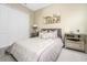 Spacious bedroom featuring a queen-size bed and mirrored dresser at 26858 Weiskopf Dr, Englewood, FL 34223