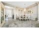 Elegant dining room with chandelier and formal table setting at 26858 Weiskopf Dr, Englewood, FL 34223