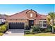 Attractive single-story home with tile roof and stone accents at 26858 Weiskopf Dr, Englewood, FL 34223