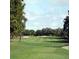 Landscaped golf course with lush green fairways at 26858 Weiskopf Dr, Englewood, FL 34223