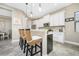 Modern kitchen with white shaker cabinets and a large island at 26858 Weiskopf Dr, Englewood, FL 34223