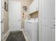 Laundry room with washer, dryer and cabinets at 26858 Weiskopf Dr, Englewood, FL 34223