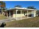 Single story home with covered carport and a neat lawn at 2710 Hibiscus St, Sarasota, FL 34239