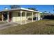 Single story home with covered entryway and a well-maintained lawn at 2710 Hibiscus St, Sarasota, FL 34239