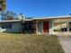 Ranch-style home with carport and mature landscaping at 2710 Hibiscus St, Sarasota, FL 34239