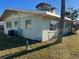 Side view of a single story house with large windows at 2710 Hibiscus St, Sarasota, FL 34239