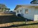 Side view of a light green house with AC unit at 2710 Hibiscus St, Sarasota, FL 34239