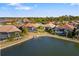 Aerial view of lakefront homes with docks at 275 Toscavilla Blvd, Nokomis, FL 34275