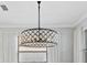 Modern drum-shaped chandelier with crystal accents at 275 Toscavilla Blvd, Nokomis, FL 34275