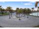 Circular entrance to community with a central fountain at 275 Toscavilla Blvd, Nokomis, FL 34275