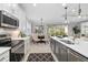 Well-designed kitchen featuring stainless steel appliances and ample counter space at 275 Toscavilla Blvd, Nokomis, FL 34275