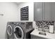 Laundry room with modern washer and dryer, and extra counter space at 275 Toscavilla Blvd, Nokomis, FL 34275