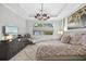 Spacious main bedroom with king-size bed and calming decor at 275 Toscavilla Blvd, Nokomis, FL 34275