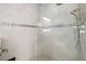 Large walk-in shower with glass enclosure and dual shower heads at 275 Toscavilla Blvd, Nokomis, FL 34275