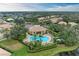 Community overview showcasing homes, pool, and lush landscaping at 2831 Whispering Pine Ln, North Port, FL 34287