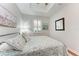 Charming bedroom with wood flooring and stylish bedding at 2831 Whispering Pine Ln, North Port, FL 34287