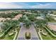 Gated community entrance with landscaping and signage at 2831 Whispering Pine Ln, North Port, FL 34287