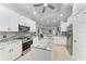 Modern kitchen with stainless steel appliances and granite countertops at 2831 Whispering Pine Ln, North Port, FL 34287