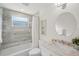 Modern bathroom with marble tile and a large vanity at 3054 Markridge Rd, Sarasota, FL 34231