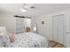 Bedroom with barn door to en-suite bathroom and built-in closet at 3054 Markridge Rd, Sarasota, FL 34231