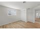 Simple bedroom with hardwood floors and white shutters at 3054 Markridge Rd, Sarasota, FL 34231