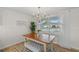 Bright dining area with wood table and bench seating at 3054 Markridge Rd, Sarasota, FL 34231