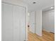 Bright hallway with light wood floors and white doors at 3054 Markridge Rd, Sarasota, FL 34231