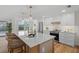 Modern kitchen with white cabinets, quartz countertops, and a large island at 3054 Markridge Rd, Sarasota, FL 34231