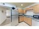 Stainless steel appliances and wood cabinets in kitchen at 318 Barlow Ave # 71, Sarasota, FL 34232