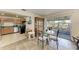 Bright kitchen with dining area and access to a relaxing patio at 318 Barlow Ave # 71, Sarasota, FL 34232