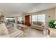 Living room with light beige couches and wood cabinet at 318 Barlow Ave # 71, Sarasota, FL 34232