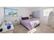 Cozy bedroom with double bed, nightstand, and large art piece at 3530 Tree Line Dr # 4, Sarasota, FL 34231