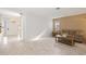 Living room with light wood floors and a comfortable sofa at 3530 Tree Line Dr # 4, Sarasota, FL 34231