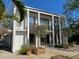 Bright, modern home boasts clean lines, large windows, and an inviting outdoor space with mature trees at 3721 Flamingo Ave, Sarasota, FL 34242