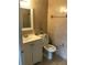 Bathroom with beige tile, toilet, and vanity at 406 Barlow Ave # 65, Sarasota, FL 34232