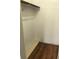 Empty closet with wood-like laminate flooring at 406 Barlow Ave # 65, Sarasota, FL 34232