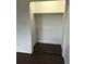 Simple closet with a hanging rod and dark floors at 406 Barlow Ave # 65, Sarasota, FL 34232