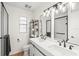 Elegant bathroom with dual vanity and modern light fixtures at 4410 Little John Trl, Sarasota, FL 34232