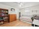 Charming bedroom with wood floors, and built-in shelving at 4410 Little John Trl, Sarasota, FL 34232