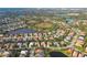 Aerial view of community with various houses, lakes, and green spaces at 4677 Sweetmeadow Cir, Sarasota, FL 34238