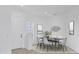 Elegant dining room with modern table and chairs, ready to host at 4677 Sweetmeadow Cir, Sarasota, FL 34238