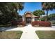 Guard house entrance to community with lush landscaping at 4677 Sweetmeadow Cir, Sarasota, FL 34238