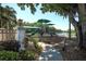 Community playground by a lake with shaded areas at 4677 Sweetmeadow Cir, Sarasota, FL 34238