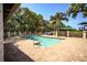 Community pool with brick pavers, and tropical landscaping at 4677 Sweetmeadow Cir, Sarasota, FL 34238