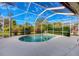 Relaxing screened-in pool with ample surrounding space at 4677 Sweetmeadow Cir, Sarasota, FL 34238