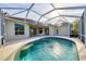 Inviting screened pool and patio area, perfect for relaxation at 4677 Sweetmeadow Cir, Sarasota, FL 34238