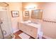 Bathroom with double vanity and walk-in shower at 5169 Oxford Dr, Sarasota, FL 34242