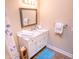 Bathroom with white vanity and marble countertop at 5169 Oxford Dr, Sarasota, FL 34242