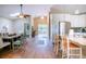 Bright dining room with hardwood floors and a large wooden table at 5169 Oxford Dr, Sarasota, FL 34242