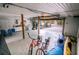 Spacious garage with storage cabinets, kayaks, and bikes at 5169 Oxford Dr, Sarasota, FL 34242